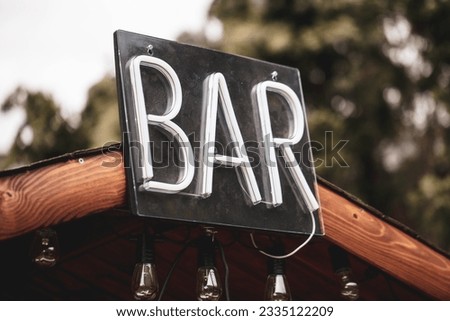 Party bar sign at night