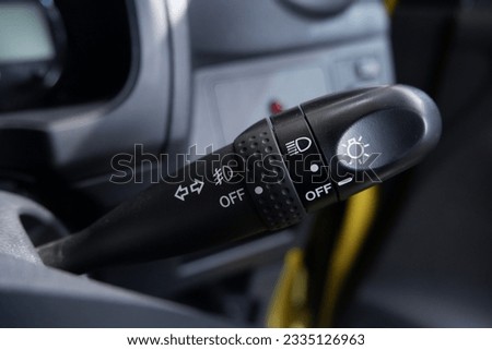 selectively focus on the handle of the car light switch control