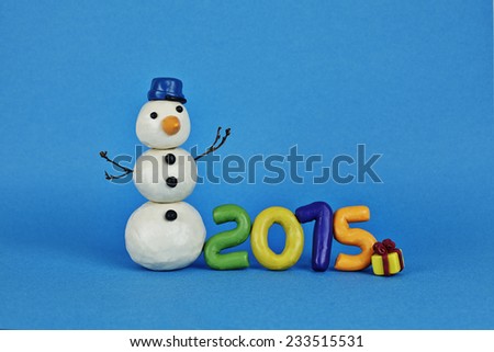 Clay snowman with gift and numbers 2015