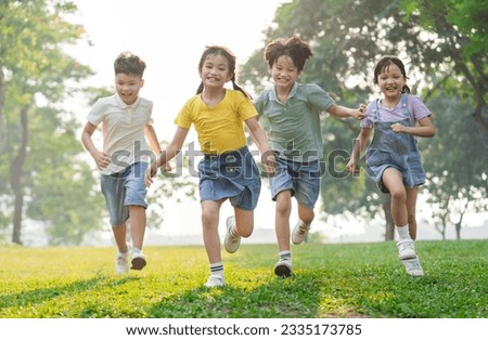 group image of asian children having fun in the park Royalty-Free Stock Photo #2335173785