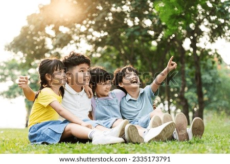 group of cute asian kids having fun in the park Royalty-Free Stock Photo #2335173791