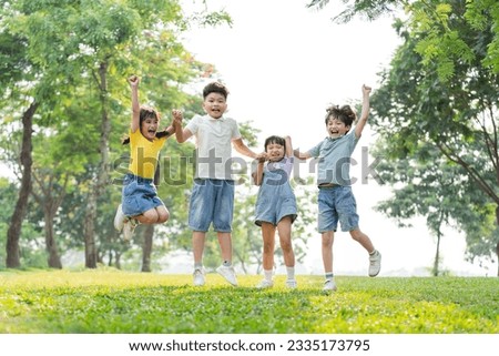 group image of asian children having fun in the park Royalty-Free Stock Photo #2335173795