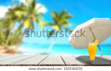 Wooden table. Sea background blurred by natural sun light.