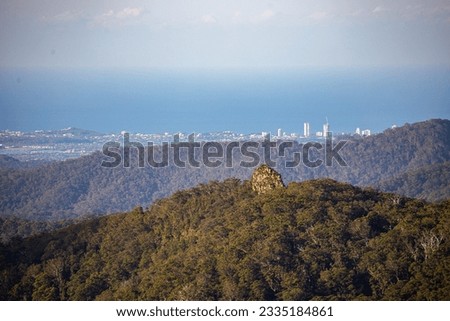 panorama of gold coast as seen from springbrook national park mountains; gold coast skyline, concrete jungle; Royalty-Free Stock Photo #2335184861