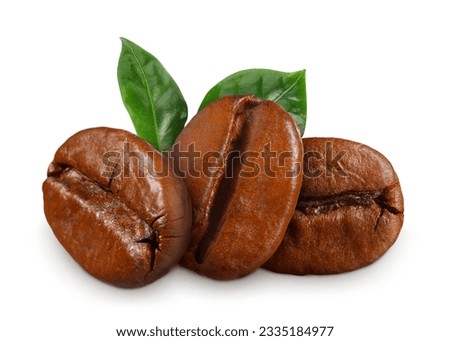 Fresh roasted coffee beans and leaves on white background Royalty-Free Stock Photo #2335184977
