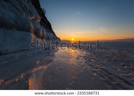 Coast of lake Baikal in winter, the deepest and largest freshwater lake by volume in the world, located in southern Siberia, Russia Royalty-Free Stock Photo #2335188731