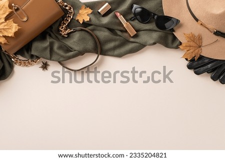 Stay stylish and cozy this fall with trendy chic purse, a fashionable felt hat, black gloves, scarf and sunglasses. Top view photo on white isolated background with space for text or advertising. Royalty-Free Stock Photo #2335204821