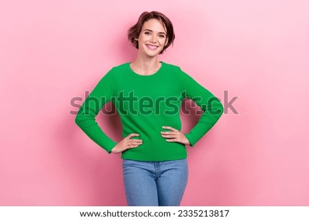 Photo of young preppy charming model posing hands touch waist wear green stylish pullover attractive girl isolated on pink color background
