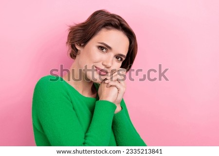 Photo of cute adorable lady wear green pullover smiling arms cheeks empty space isolated pink color background