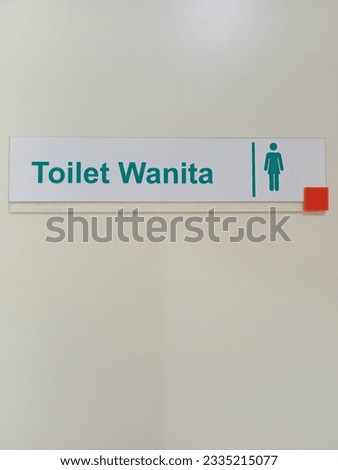 Photo of toilet sign (men and women)on a white background