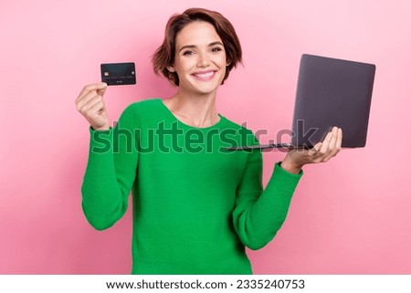 Photo of cheerful shiny girl dressed green sweater online shopping apple samsung modern gadget isolated pink color background