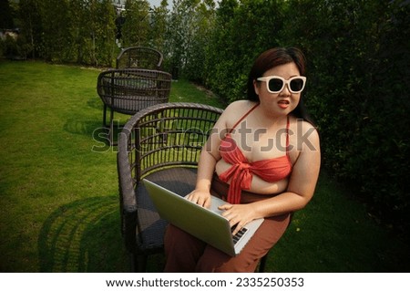 Obese Woman Vacation Traveling Laptop swimming pool holiday remote online working digital Freelance work studying online e-learning.