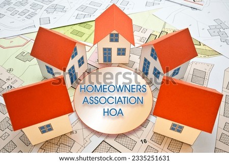 Homeowner Association - concept with miniature house models in circles Royalty-Free Stock Photo #2335251631