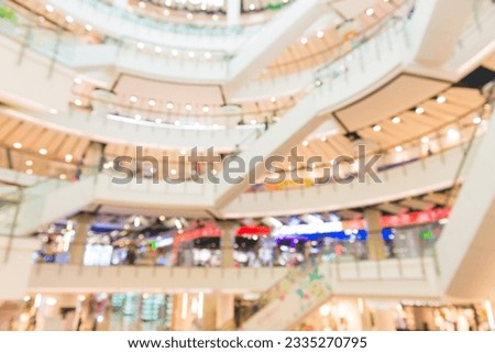 Blurred interior of mall retail business store with blur people