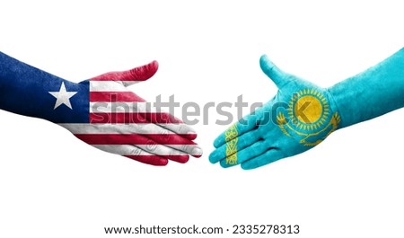 Handshake between Kazakhstan and Liberia flags painted on hands, isolated transparent image.