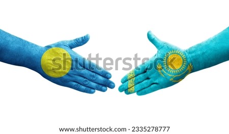 Handshake between Kazakhstan and Palau flags painted on hands, isolated transparent image.