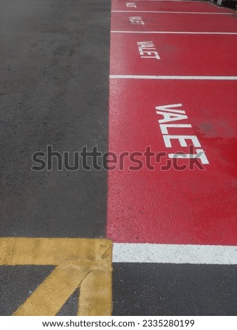Valet Parking. Sign painted on the road surface.