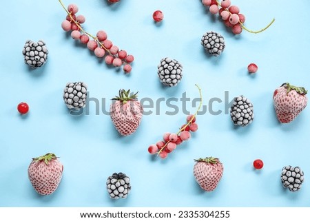 Frozen berries on blue background