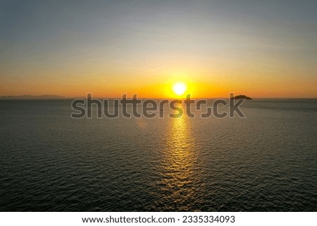 Aerial Sunset ocean view and Hills, golden time view in Labuan Bajo
