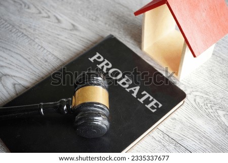 Toy house, gavel and text PROBATE. Real estate and law concept Royalty-Free Stock Photo #2335337677