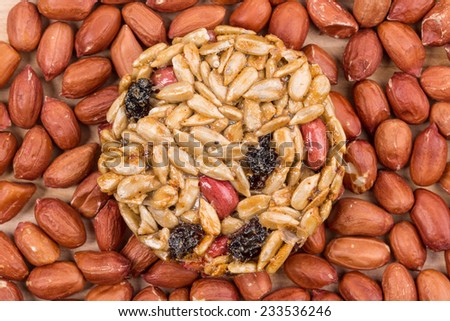 Candied peanuts sunflower seeds on peanuts. Whole background.