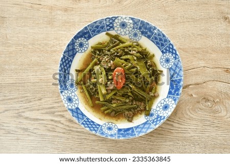 stir fried slice Thai morning glory with chop pork and chili on plate  Royalty-Free Stock Photo #2335363845