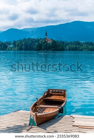 A view of a boat moored on the side of Lake Bled in Bled, Slovenia in summertime Royalty-Free Stock Photo #2335369083