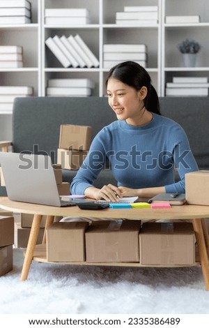 Portrait of Starting small businesses SME owners female entrepreneurs working on receipt box and check online orders to prepare to pack the boxes, sell to customers, SME business ideas online.