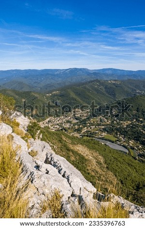 Village of Sumene at the bottom of the valley, south of the Cevennes, from the summit of the Ranc de Banes Royalty-Free Stock Photo #2335396763