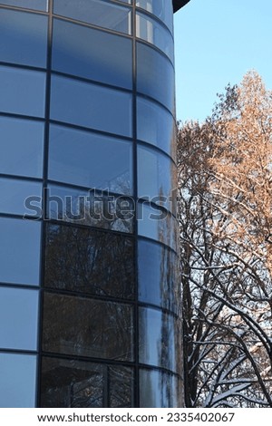 rounded corner of the glass facade of a modern building