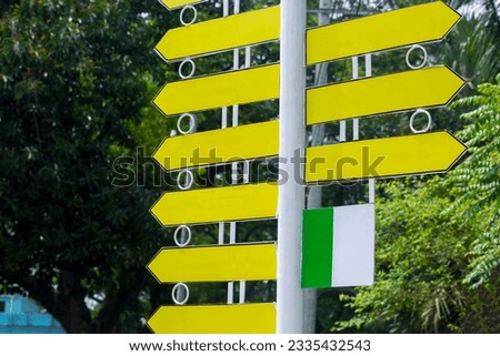 Roadside steel-making signposts are used to display instructions and information. Yellow color road route direction pointer. Roadside Instructional blank Sign.