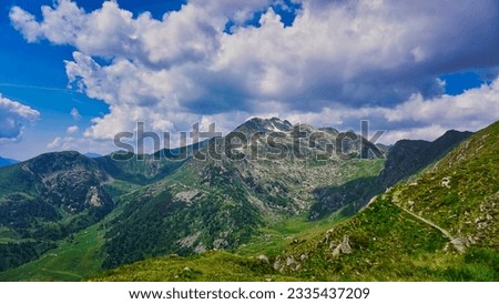 Italian Landscape: Mountain landscape in summer above 2000 meters asl. "Passo San Marco," in the province of Bergamo, Italy. The scenery overlooks the Valtellina valley and the surrounding mountains. Royalty-Free Stock Photo #2335437209