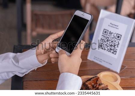 use smartphone to scan QR code for order menu in cafe restaurant with a digital delivery. Choose menu and order accumulate discount. E wallet, technology, pay online, credit card, bank app.