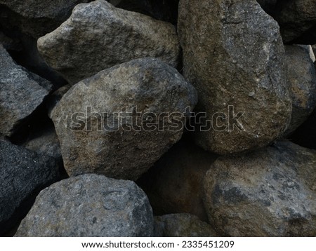 neatly arranged natural stones for the foundation of the house