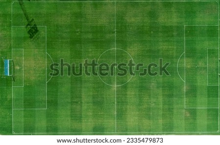 zenithal aerial view of a natural grass football field Royalty-Free Stock Photo #2335479873