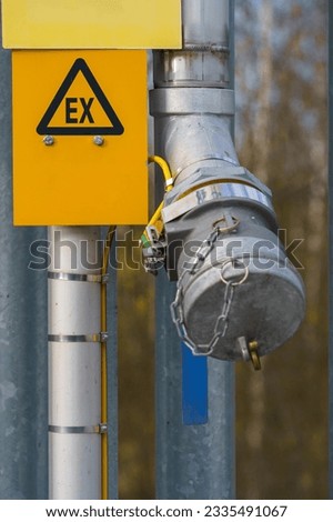 EX - sign for Explosive Atmosphere in gas station.