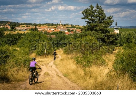 Cycling in south moravian region of Czech Republic. Beautiful rural landscape around Znojmo with vineyards and many hiking trails and mountain biking routes Royalty-Free Stock Photo #2335503863