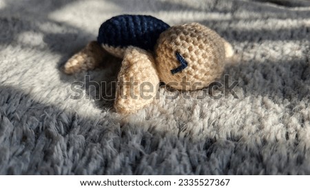 Blue and white knitted sea turtle
