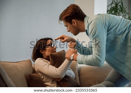 Young couple having argument-conflict, bad relationships. Angry men yells at a woman. Royalty-Free Stock Photo #2335531065