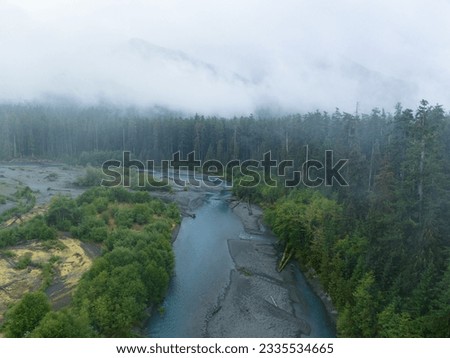 Located on the Olympic Peninsula, the Hoh river flows through one of the largest temperate rainforests in the U.S. Receiving over 100 inches of rain annually, the region is lush with flora and fauna. Royalty-Free Stock Photo #2335534665