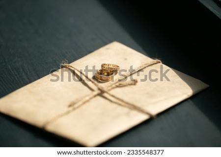 wedding rings,vintage picture style, beautiful wedding golden rings on dark background