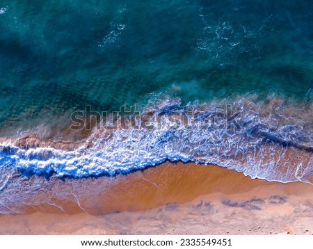 Waves crashing on sandy shore,Sea ocean waves background