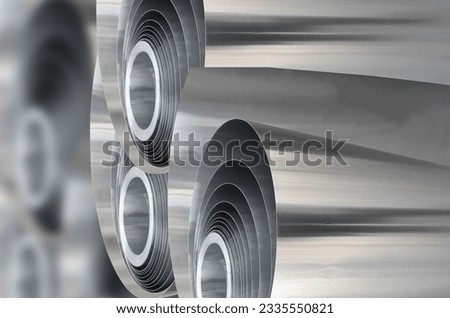 three rolls of aluminum metal material with blur background. selective focus Royalty-Free Stock Photo #2335550821