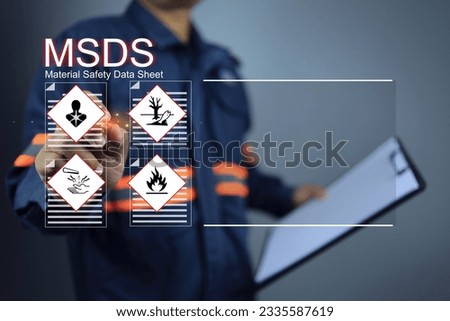 Safety officer or engineer holding clipboard and writing on MSDS material safety data sheet indicate chemical basic information antidote or hazard to the body in area of use for safety emergency case Royalty-Free Stock Photo #2335587619