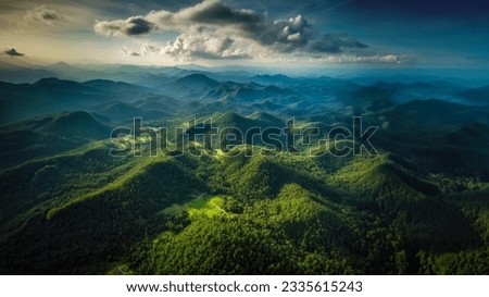 Aerial top view forest tree, Rainforest ecosystem and healthy environment concept background, Texture of green tree forest view from above, Beautiful sunrise over the mountains of western Thailand. Royalty-Free Stock Photo #2335615243