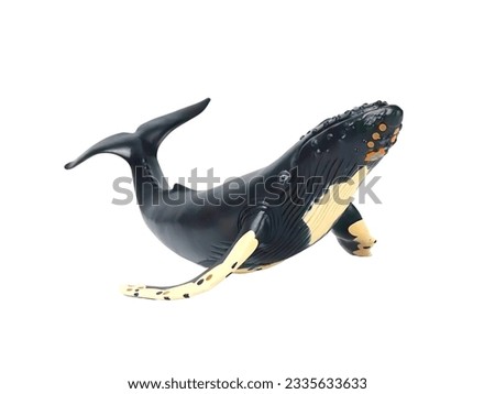 Whale black and white color miniature animal isolated on white
