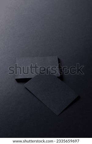 Black business cards with copy space on black background. Business, business card, stationery and writing space digitally generated image.