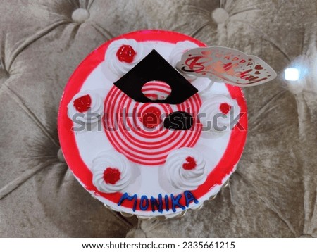 Udaipur, India - April 17 2021: Mixed fruit Cherry Birthday Cake | Red White Cake | Birthday Celebration
