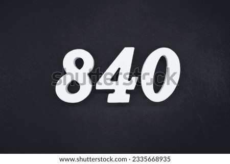 Black for the background. The number 840 is made of white painted wood.