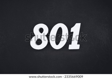 Black for the background. The number 801 is made of white painted wood.